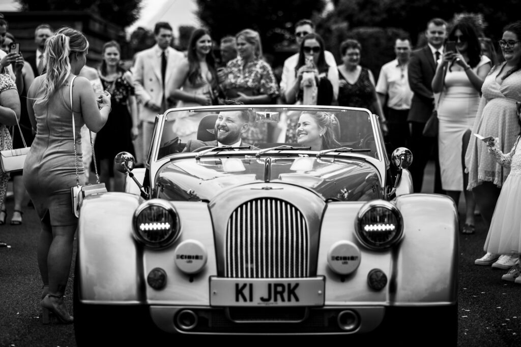 wedding couple in car